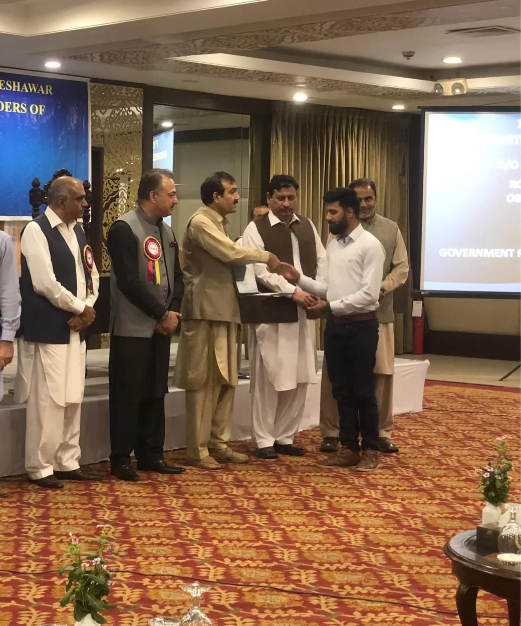 Abdul Mateen receiving first position award in Computer Information Technology